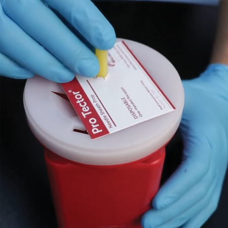 Disposing of a Needle in a Sharps Container